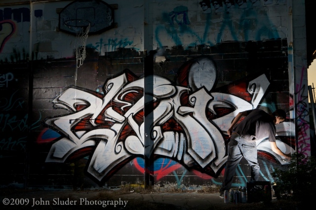 Cynic working on a new piece at dusk